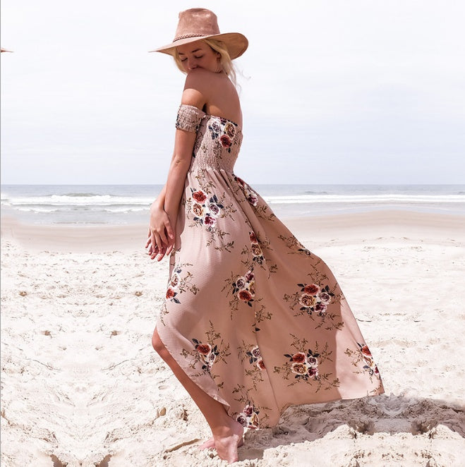 Boho style long dress women Off shoulder beach summer dresses worn by woman at beach with floral pattern and hat.