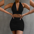2pcs Dress Suits For Women Halter Lace-up Hip Top And Pleated Hip-covering Skirt in black color displayed on a model.